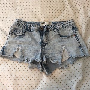 Distressed mid rise jean shorts